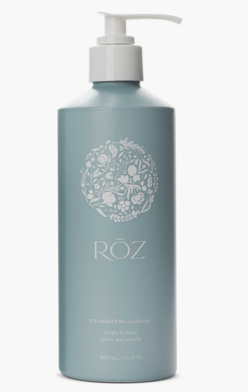 sea foam green bottle with white pump and floral design with brand name ROZ